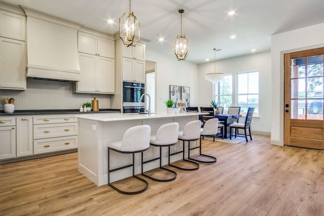 407 Baldwin Dr, Joshua, TX 76058 - kitchen featuring a chandelier, light wood finished floors, decorative backsplash, healthy amount of natural light, and recessed lighting
