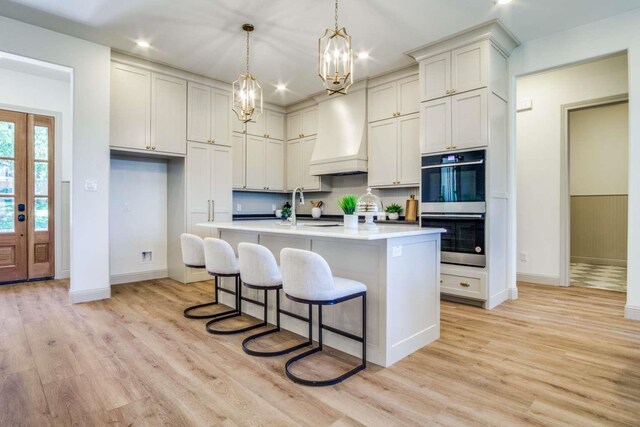 407 Baldwin Dr, Joshua, TX 76058 - kitchen featuring stainless steel double oven, a chandelier, custom range hood, baseboards, and recessed lighting