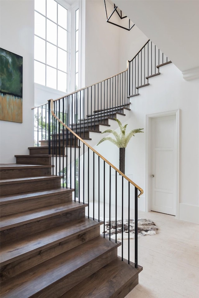 5531 Walnut Hill Ln, Dallas, TX 75229 - stairs with a high ceiling and carpet floors