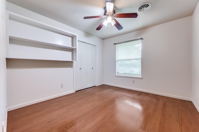 2972 Maydelle Ln, Farmers Branch, TX 75234 - unfurnished bedroom with baseboards, wood finished floors, a closet, and ceiling fan