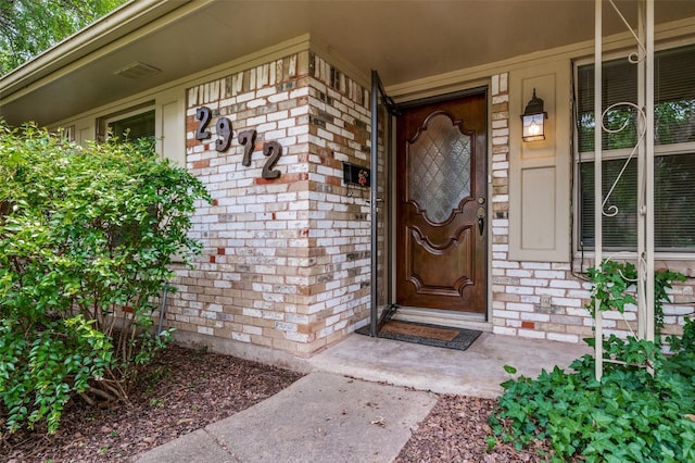 2972 Maydelle Ln, Farmers Branch, TX 75234 - view of exterior entry featuring brick siding