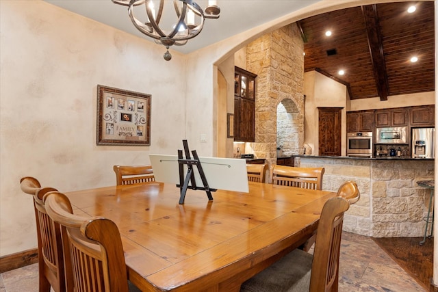 3712 Lonesome Creek Rd, Granbury, TX 76049 - dining room with arched walkways, wood ceiling with exposed beams, high vaulted ceiling, recessed lighting, and baseboards
