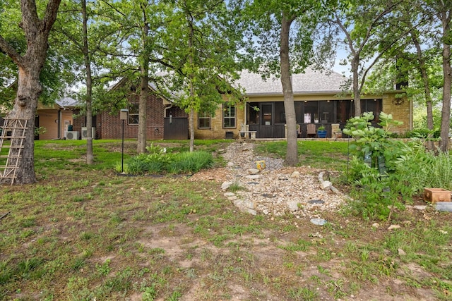 3712 Lonesome Creek Rd, Granbury, TX 76049 - back of house with a sunroom and brick siding