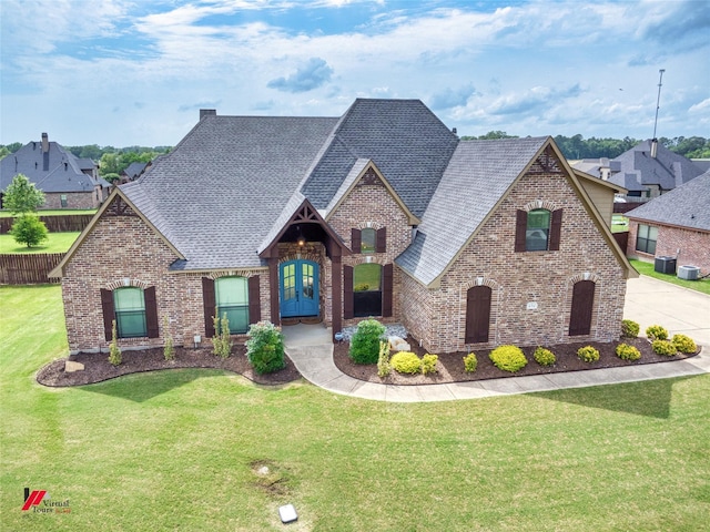 171 Lori Dr, Stonewall, LA 71078 - view of front of property with brick siding, roof with shingles, and a front yard