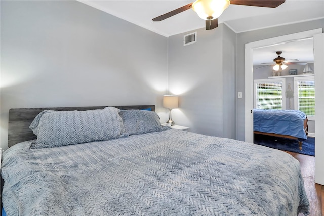 6505 Oakwood Lake Ct, Granbury, TX 76049 - bedroom featuring a ceiling fan and wood finished floors