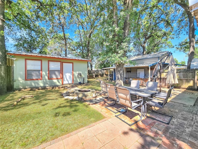 6505 Oakwood Lake Ct, Granbury, TX 76049 - view of yard with a fire pit, a patio, and outdoor dining space