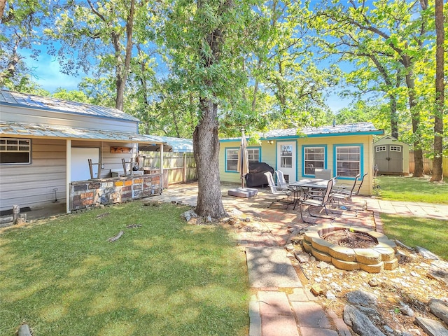 6505 Oakwood Lake Ct, Granbury, TX 76049 - view of yard featuring an outdoor fire pit and a patio