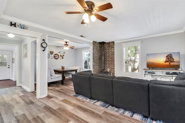 6505 Oakwood Lake Ct, Granbury, TX 76049 - living room with a ceiling fan, healthy amount of natural light, light wood-type flooring, and crown molding