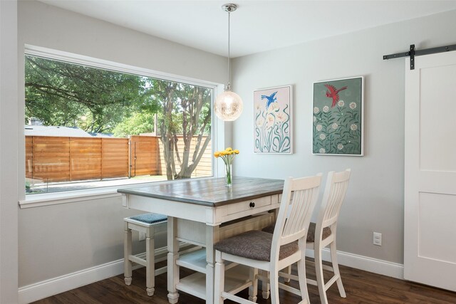 4018 Crown Shore Dr, Dallas, TX 75244 - dining area with healthy amount of natural light, baseboards, wood finished floors, and a barn door