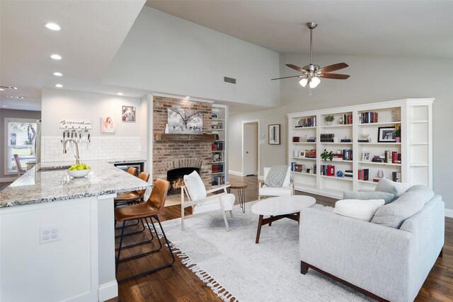 4018 Crown Shore Dr, Dallas, TX 75244 - living room featuring ceiling fan, a fireplace, recessed lighting, dark wood-style flooring, and vaulted ceiling