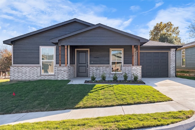 2404 Miller St, Denison, TX 75020 - view of front of home featuring concrete driveway, a garage, a front yard, and a porch