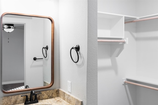 2404 Miller St, Denison, TX 75020 - bathroom with a sink and a ceiling fan