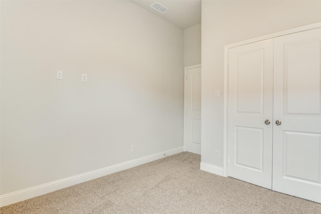 500 Melody Cir, Kaufman, TX 75142 - unfurnished bedroom with light colored carpet, baseboards, and a closet