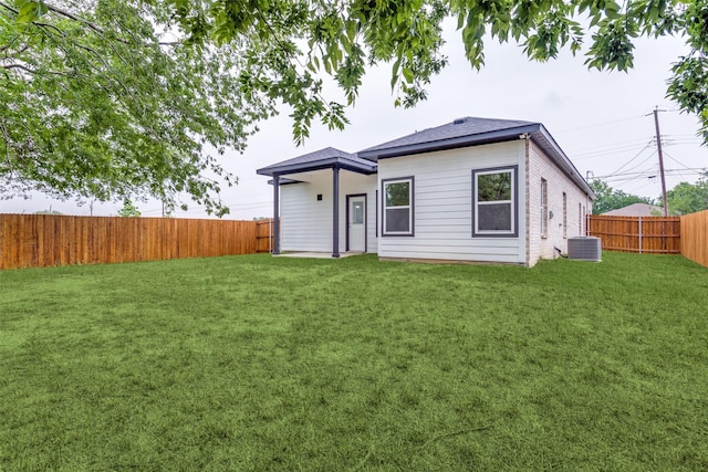 500 Melody Cir, Kaufman, TX 75142 - back of house featuring central AC