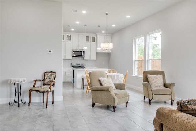 500 Melody Cir, Kaufman, TX 75142 - living area with recessed lighting, baseboards, and a chandelier