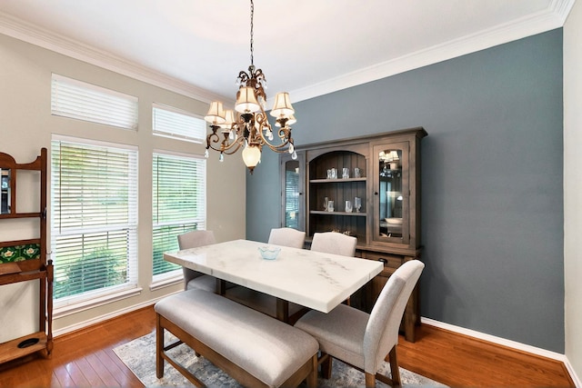 6916 Arvida Dr, Plano, TX 75023 - dining room featuring a chandelier, dark wood-type flooring, ornamental molding, and baseboards