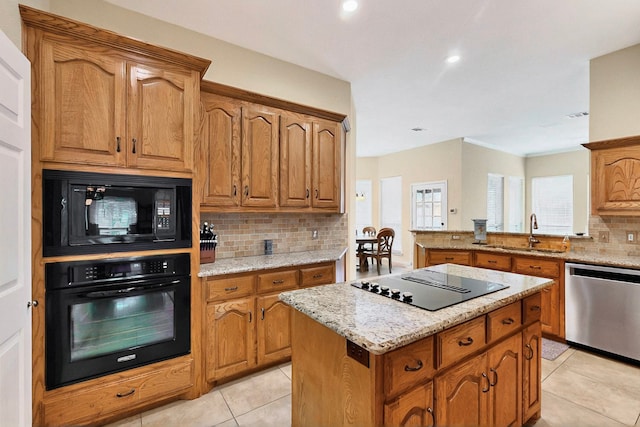6916 Arvida Dr, Plano, TX 75023 - kitchen featuring black appliances, a sink, backsplash, light tile patterned flooring, and light stone countertops