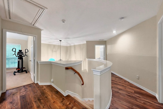 6916 Arvida Dr, Plano, TX 75023 - hallway with an upstairs landing, dark wood-style floors, baseboards, and attic access