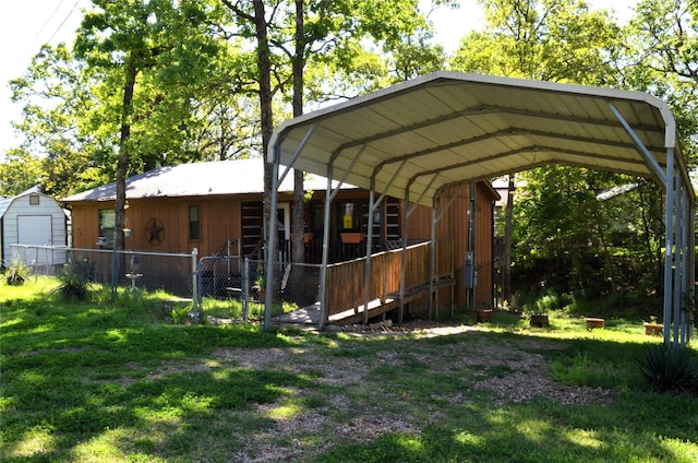 123 Little River Bnd, Mabank, TX 75156 - view of parking with a storage shed and a carport