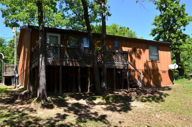 123 Little River Bnd, Mabank, TX 75156 - rear view of property with stairway, a wooden deck, and board and batten siding