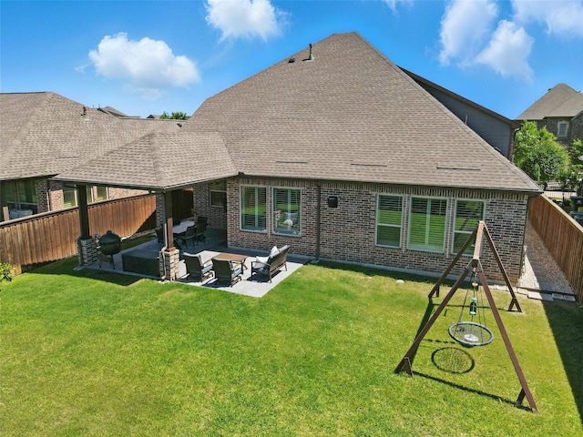 915 Prairie Ridge Ln, Arlington, TX 76005 - back of property featuring an outdoor hangout area, brick siding, a patio area, and roof with shingles