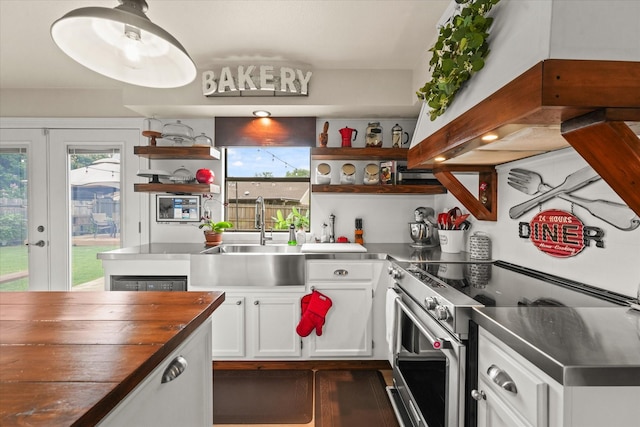 2302 Warwick Ave, Grand Prairie, TX 75052 - kitchen featuring open shelves, electric range, a sink, and exhaust hood