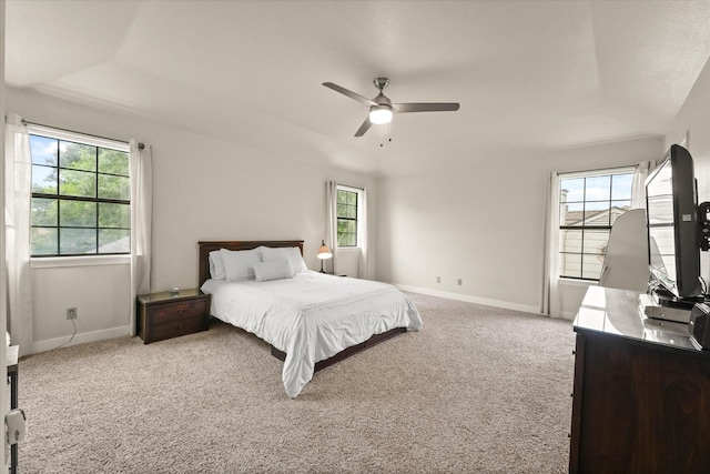 2302 Warwick Ave, Grand Prairie, TX 75052 - carpeted bedroom with multiple windows, baseboards, ceiling fan, a raised ceiling, and vaulted ceiling