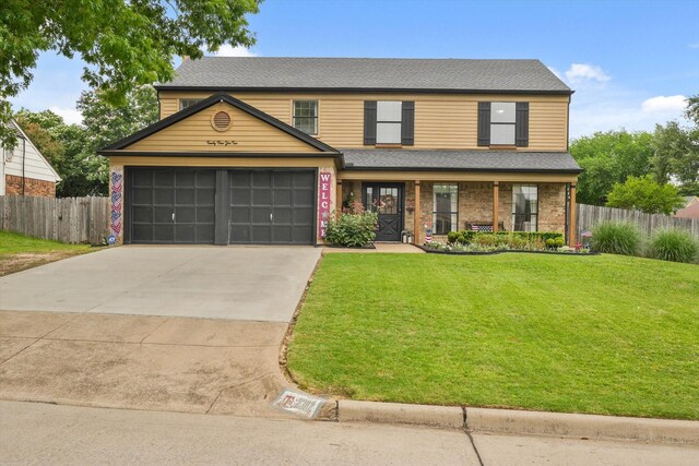 2302 Warwick Ave, Grand Prairie, TX 75052 - view of front of home with an attached garage, concrete driveway, a porch, a shingled roof, and brick siding