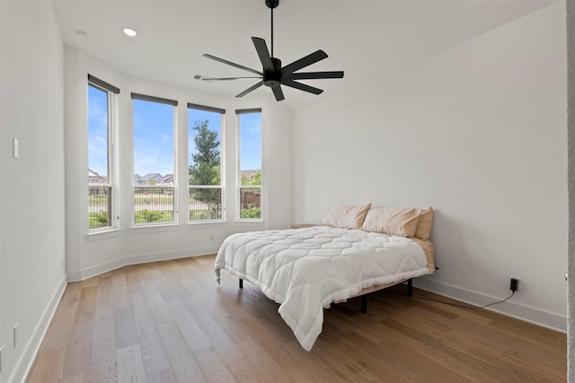 1812 Welker Dr, Van Alstyne, TX 75495 - bedroom featuring baseboards, wood finished floors, ceiling fan, and recessed lighting