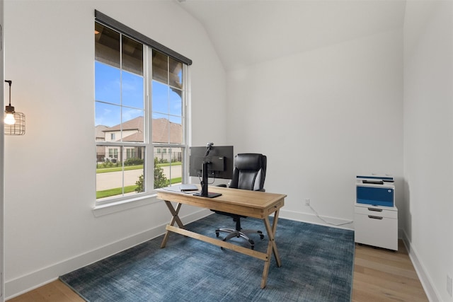 1812 Welker Dr, Van Alstyne, TX 75495 - office area with wood finished floors, baseboards, and vaulted ceiling