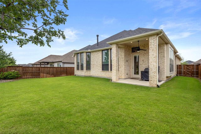1812 Welker Dr, Van Alstyne, TX 75495 - rear view of property with ceiling fan, a patio area, a shingled roof, and brick siding