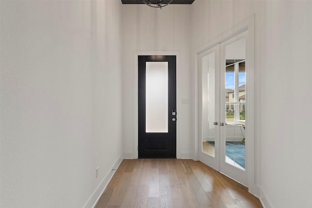 1812 Welker Dr, Van Alstyne, TX 75495 - foyer entrance featuring french doors, light wood-style flooring, and baseboards
