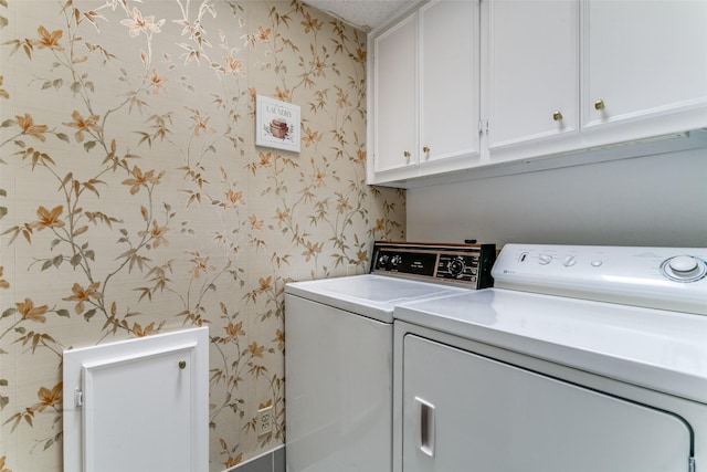 907 Glen Dell Dr, Irving, TX 75061 - laundry room with wallpapered walls, washer and clothes dryer, and cabinet space