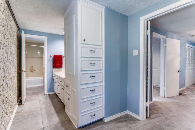 907 Glen Dell Dr, Irving, TX 75061 - hall with a textured ceiling and baseboards