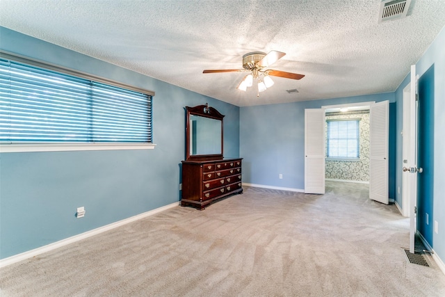 907 Glen Dell Dr, Irving, TX 75061 - unfurnished room with ceiling fan, carpet flooring, and a textured ceiling