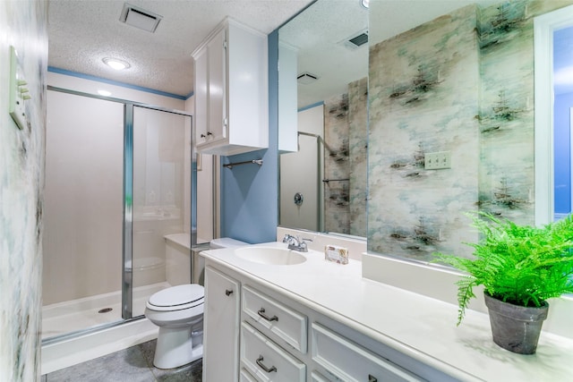 907 Glen Dell Dr, Irving, TX 75061 - bathroom with a stall shower, a textured ceiling, and vanity