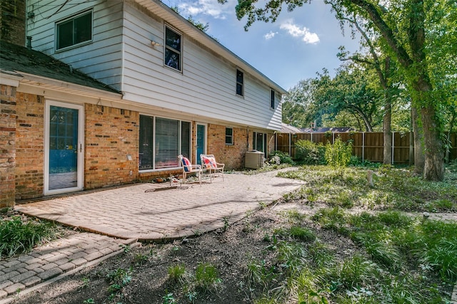907 Glen Dell Dr, Irving, TX 75061 - rear view of house featuring brick siding, a patio, and a fenced backyard