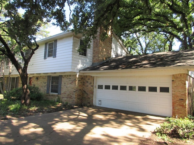 907 Glen Dell Dr, Irving, TX 75061 - view of front of property with brick siding, concrete driveway, and a garage