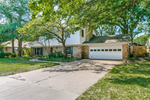 907 Glen Dell Dr, Irving, TX 75061 - view of front of house featuring brick siding, driveway, and a garage
