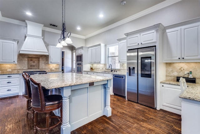 11626 Capitan Ln, Frisco, TX 75033 - kitchen featuring appliances with stainless steel finishes, a sink, decorative backsplash, premium range hood, and recessed lighting