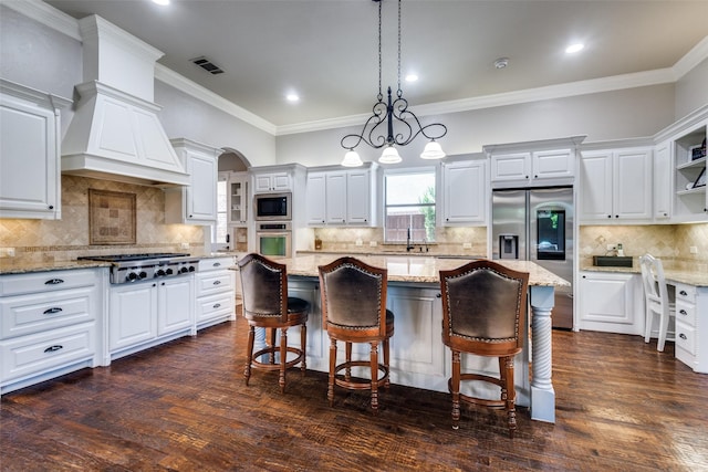 11626 Capitan Ln, Frisco, TX 75033 - kitchen featuring appliances with stainless steel finishes, decorative backsplash, white cabinets, crown molding, and open shelves