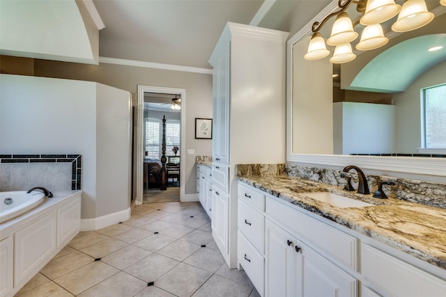 11626 Capitan Ln, Frisco, TX 75033 - ensuite bathroom featuring vanity, a bath, crown molding, baseboards, and tile patterned floors