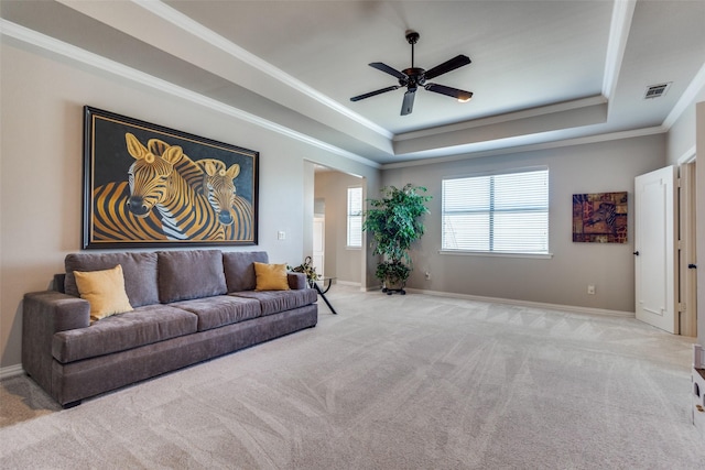 11626 Capitan Ln, Frisco, TX 75033 - living room with a tray ceiling, carpet floors, ceiling fan, ornamental molding, and baseboards