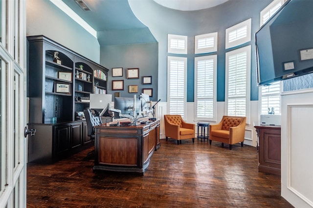 11626 Capitan Ln, Frisco, TX 75033 - home office with dark wood-type flooring, a high ceiling, and wainscoting