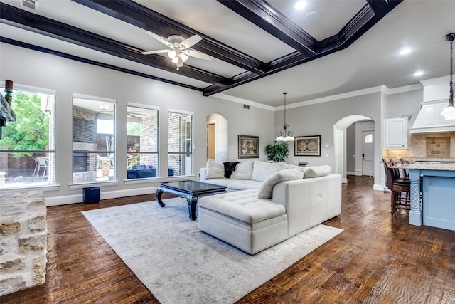 11626 Capitan Ln, Frisco, TX 75033 - living area featuring arched walkways, ornamental molding, beam ceiling, ceiling fan, and dark wood finished floors