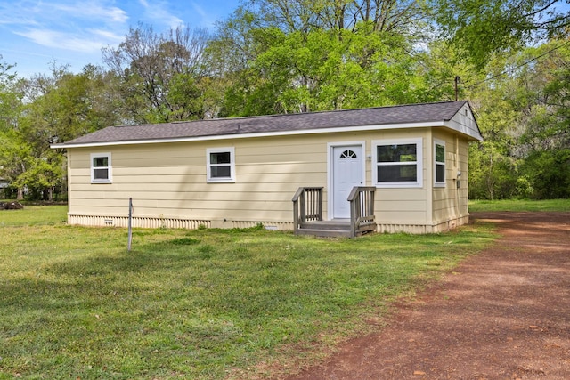 310 Reynolds, Pittsburg, TX 75686 - view of front of property featuring a front lawn