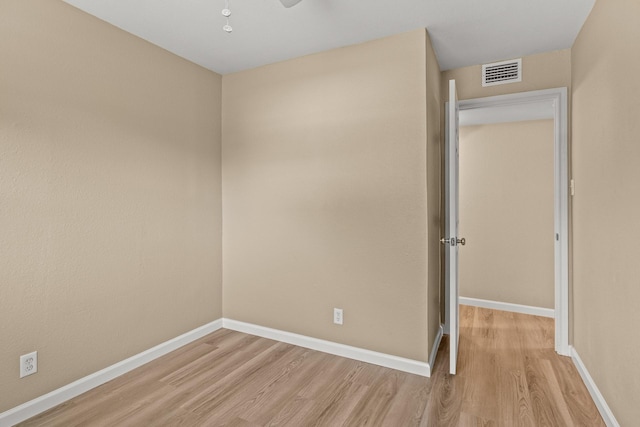 310 Reynolds, Pittsburg, TX 75686 - spare room featuring light wood-style flooring, baseboards, and ceiling fan