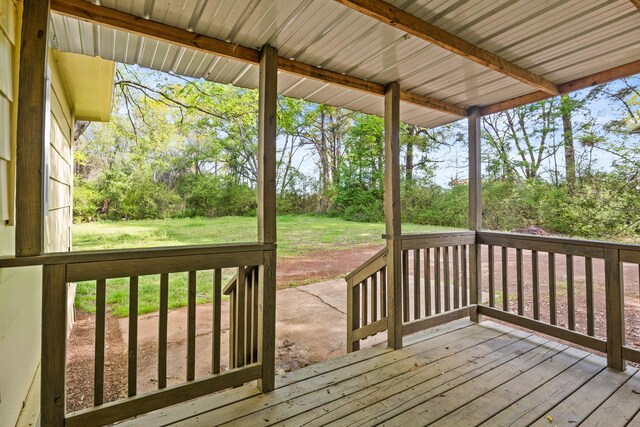 310 Reynolds, Pittsburg, TX 75686 - wooden terrace with a lawn