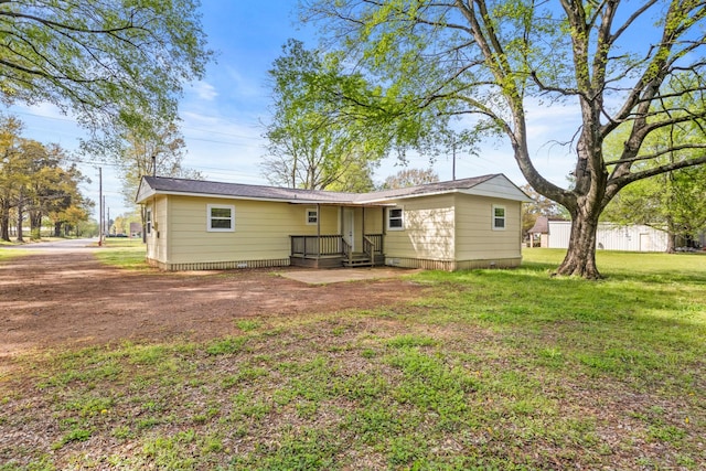 310 Reynolds, Pittsburg, TX 75686 - back of property featuring a yard and crawl space