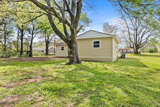310 Reynolds, Pittsburg, TX 75686 - view of grassy yard with central AC unit